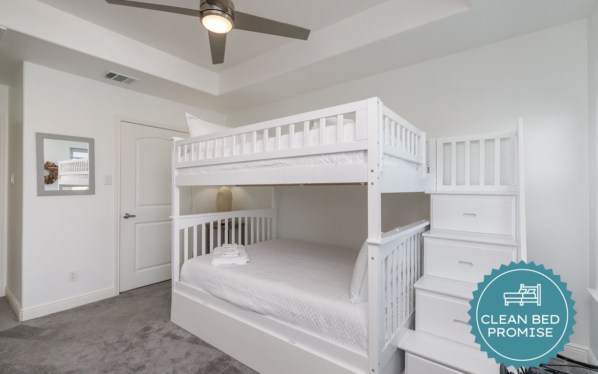 Your kids will love this bright bunk bed room with built-in stairs and storage drawers for all their treasures.