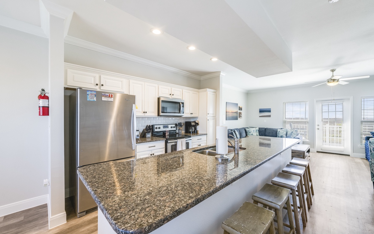 Your gourmet kitchen features granite countertops, stainless appliances, and a breakfast bar perfect for morning coffee with friends.