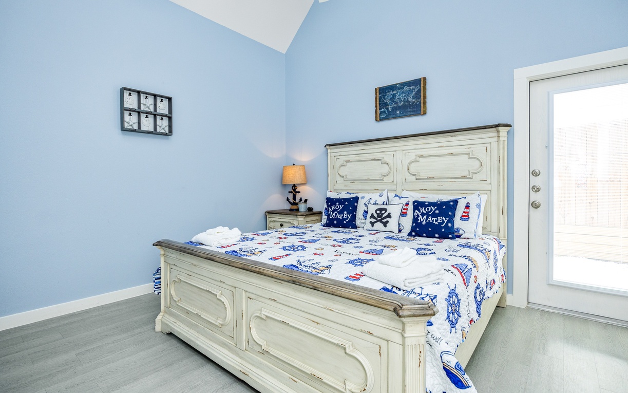 Drift to sleep in your charming nautical bedroom with soft blue walls and playful maritime bedding that captures seaside tranquility perfectly.