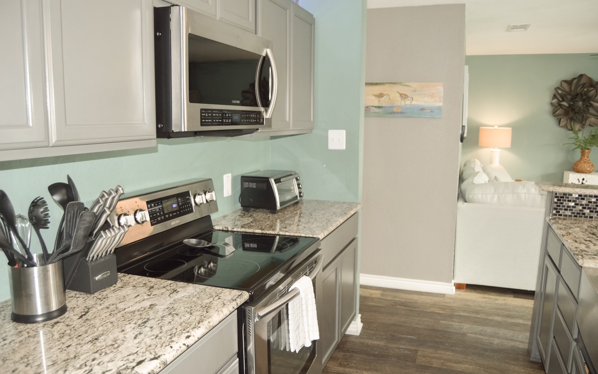 Your fully equipped kitchen features granite countertops, stainless steel appliances, and everything you need to create memorable meals during your stay.