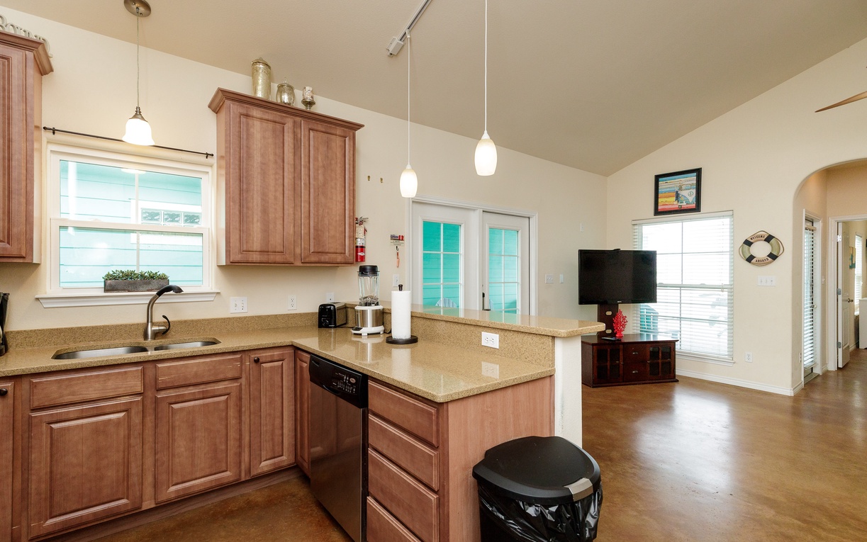 Your open kitchen flows seamlessly into the living area, creating perfect space for cooking and relaxing together.