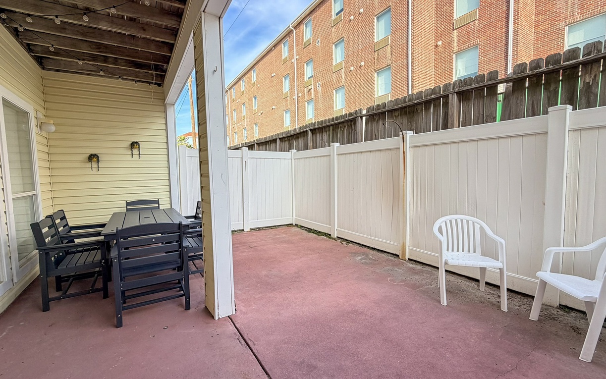 Your private patio offers peaceful outdoor dining with comfortable seating, perfect for morning coffee or evening relaxation in your own secluded space.