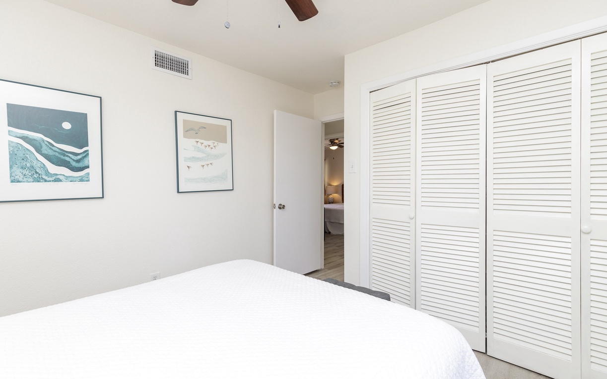 Drift off to sleep in your serene bedroom with ocean-inspired art and ample storage for your belongings.