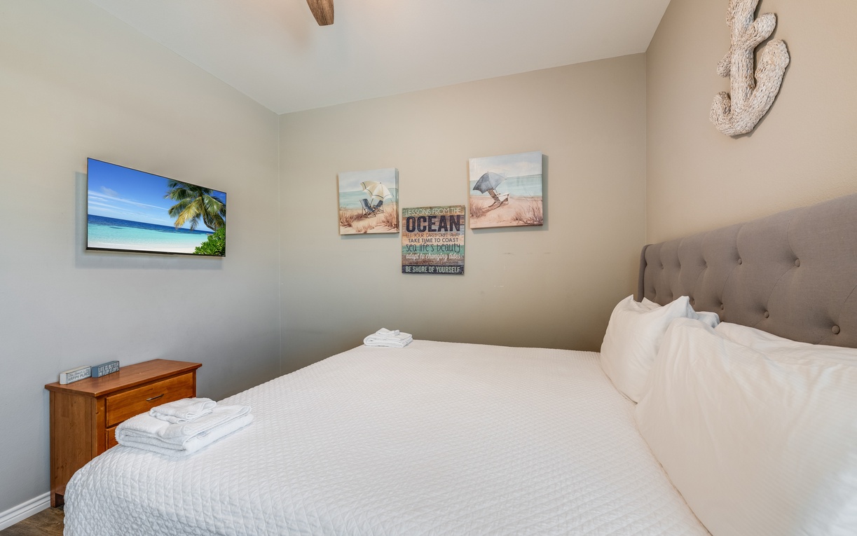 Your coastal-themed bedroom invites peaceful rest with crisp linens, ocean artwork, and thoughtful touches that make you feel instantly at home.