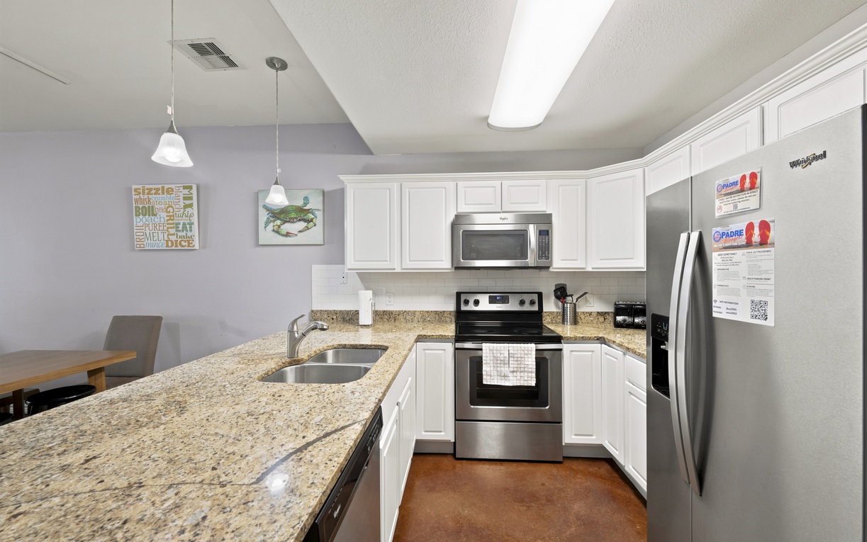 Your fully equipped kitchen invites you to whip up delicious meals with sparkling granite countertops, stainless steel appliances, and all the modern conveniences. The open layout makes cooking and entertaining a breeze.