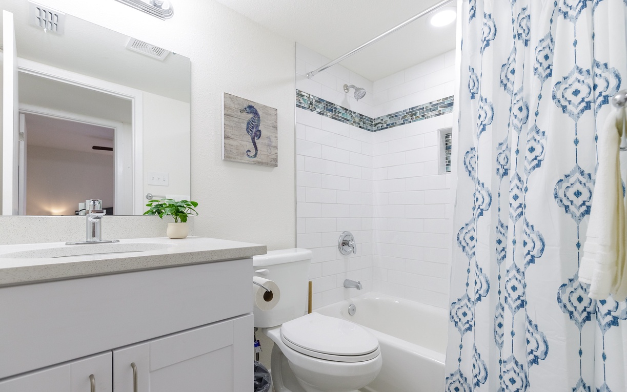 Refresh in this bright bathroom with coastal charm and modern touches.