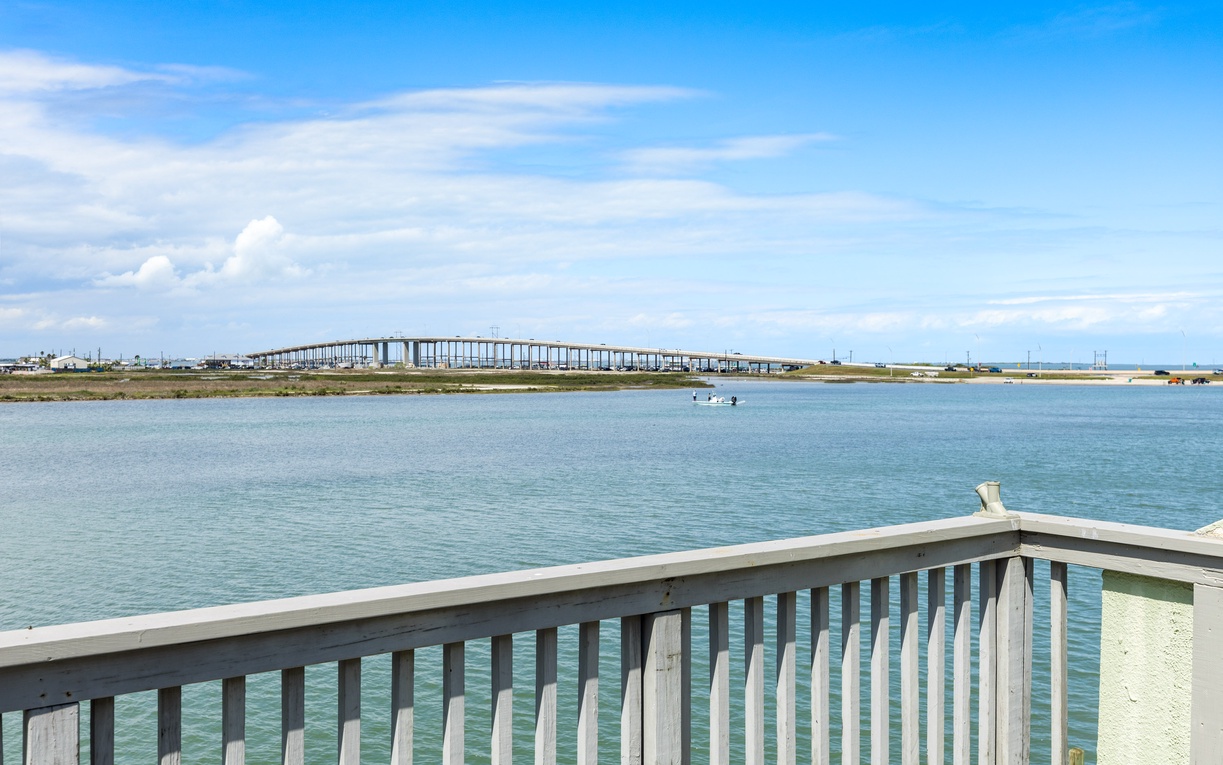 Panoramic waterfront vista showcasing the scenic coastline and iconic bridge spanning the inlet.