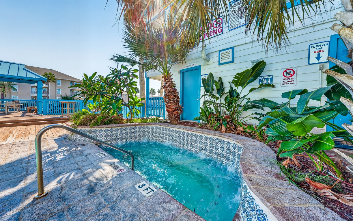Slip into warm bubbles under swaying palms and sunny coastal skies. This tropical hot tub offers the perfect spot to unwind after beach adventures, surrounded by lush greenery and island charm.