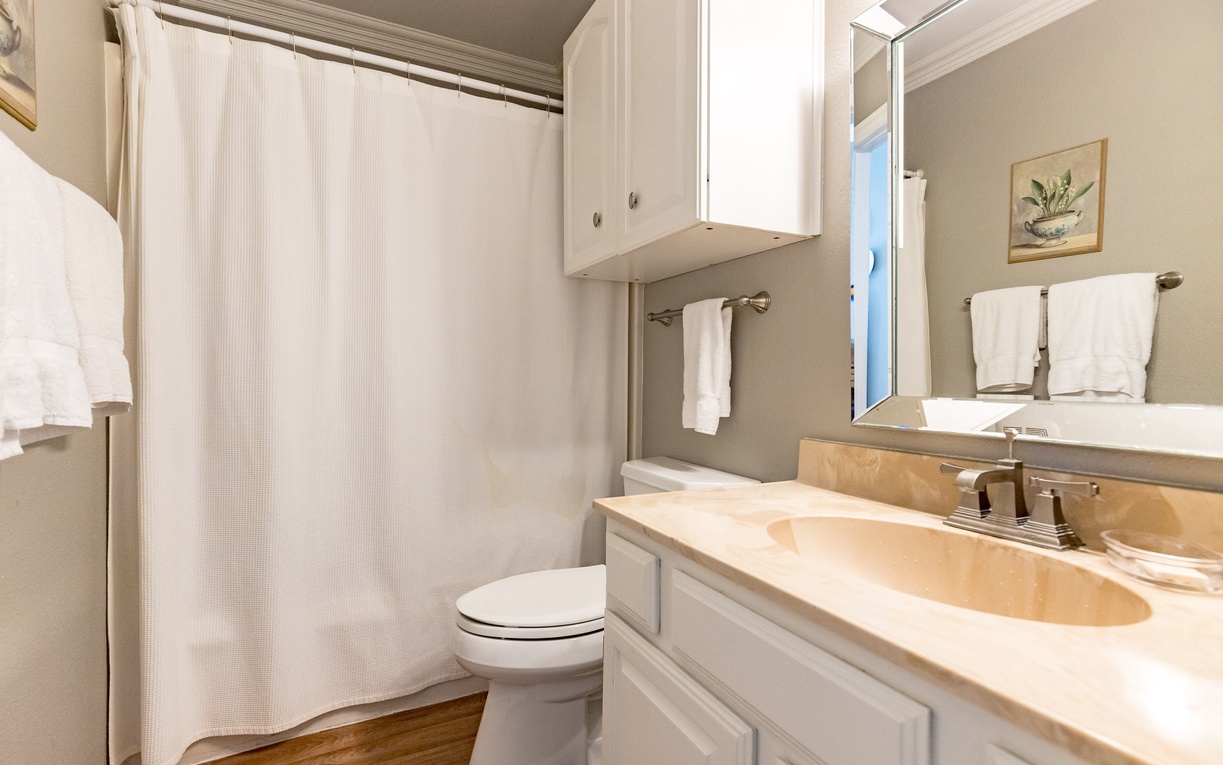 Step into your private bathroom retreat with elegant marble countertops, plush towels, and everything you need for a refreshing start to your day.
