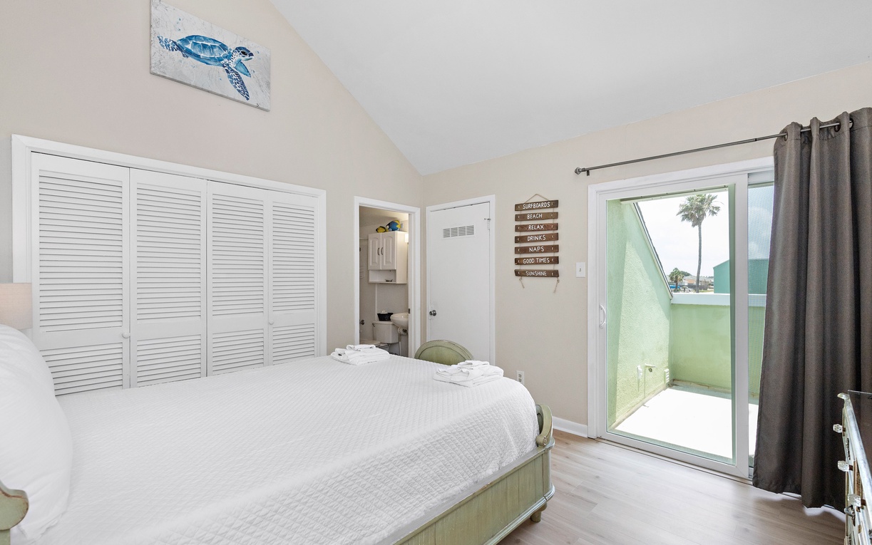 Wake up in your coastal retreat with ocean-inspired decor and doors opening to your private balcony.