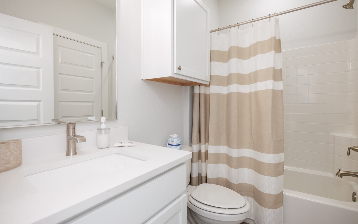 Step into your pristine bathroom with crisp white finishes and thoughtful touches that make your morning routine feel effortlessly elegant.