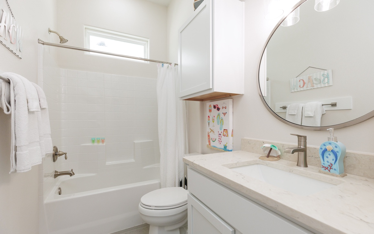 Your private bathroom features a relaxing tub-shower combo, modern vanity, and thoughtful touches that make your stay comfortable.