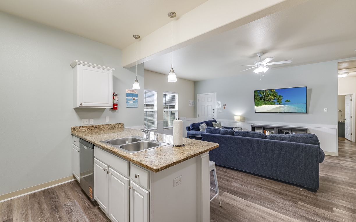 Relax in your spacious open-plan retreat with a fully equipped kitchen island perfect for preparing meals while staying connected to your group.