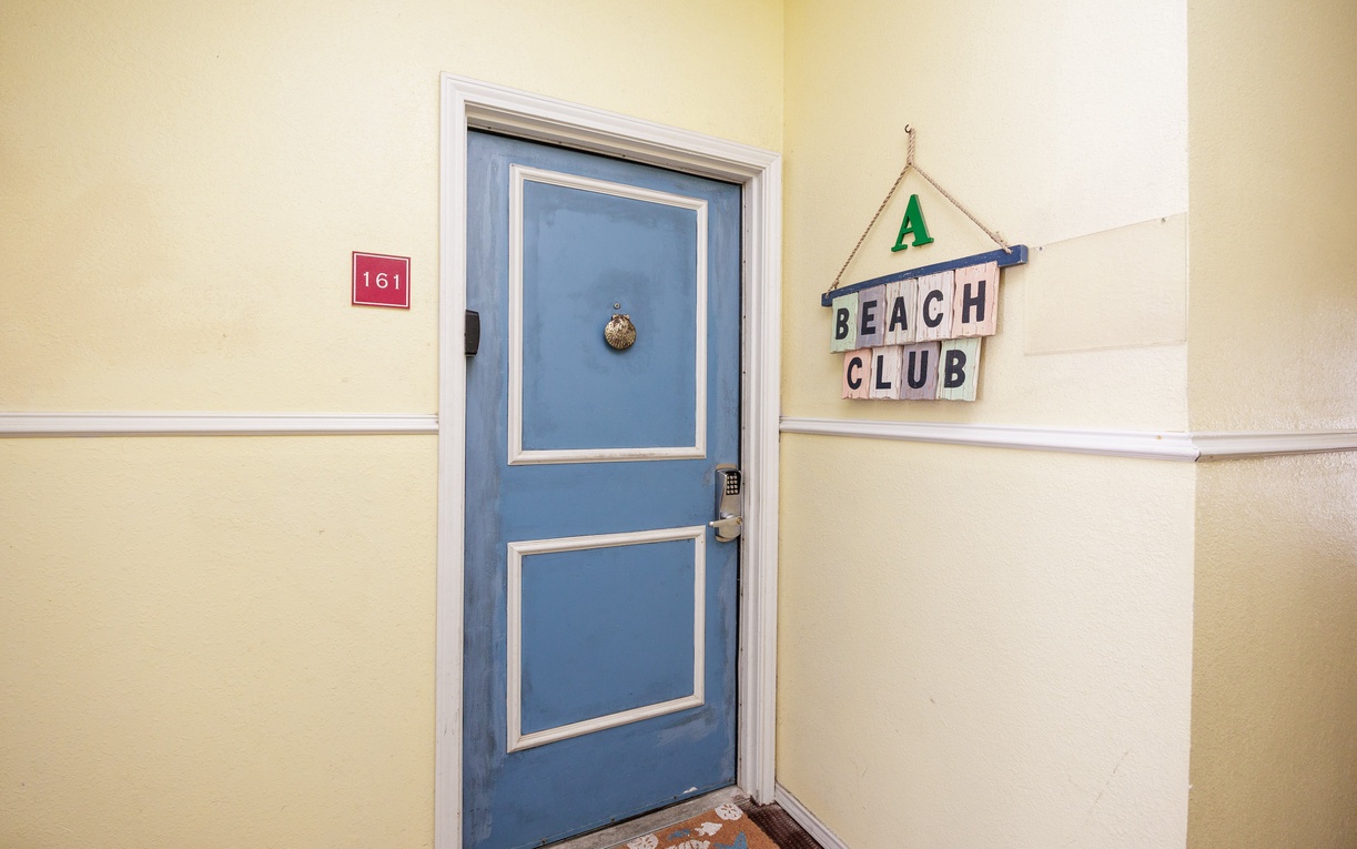 Your beachside retreat awaits behind this charming blue door, where coastal vibes and comfortable accommodations create the perfect seaside escape.