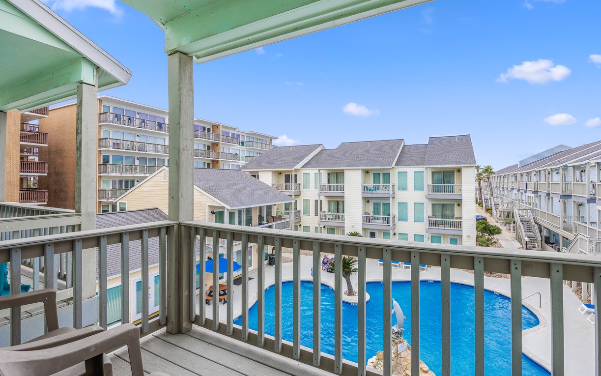 Enjoy a view of the pool from the private guest bedroom balcony