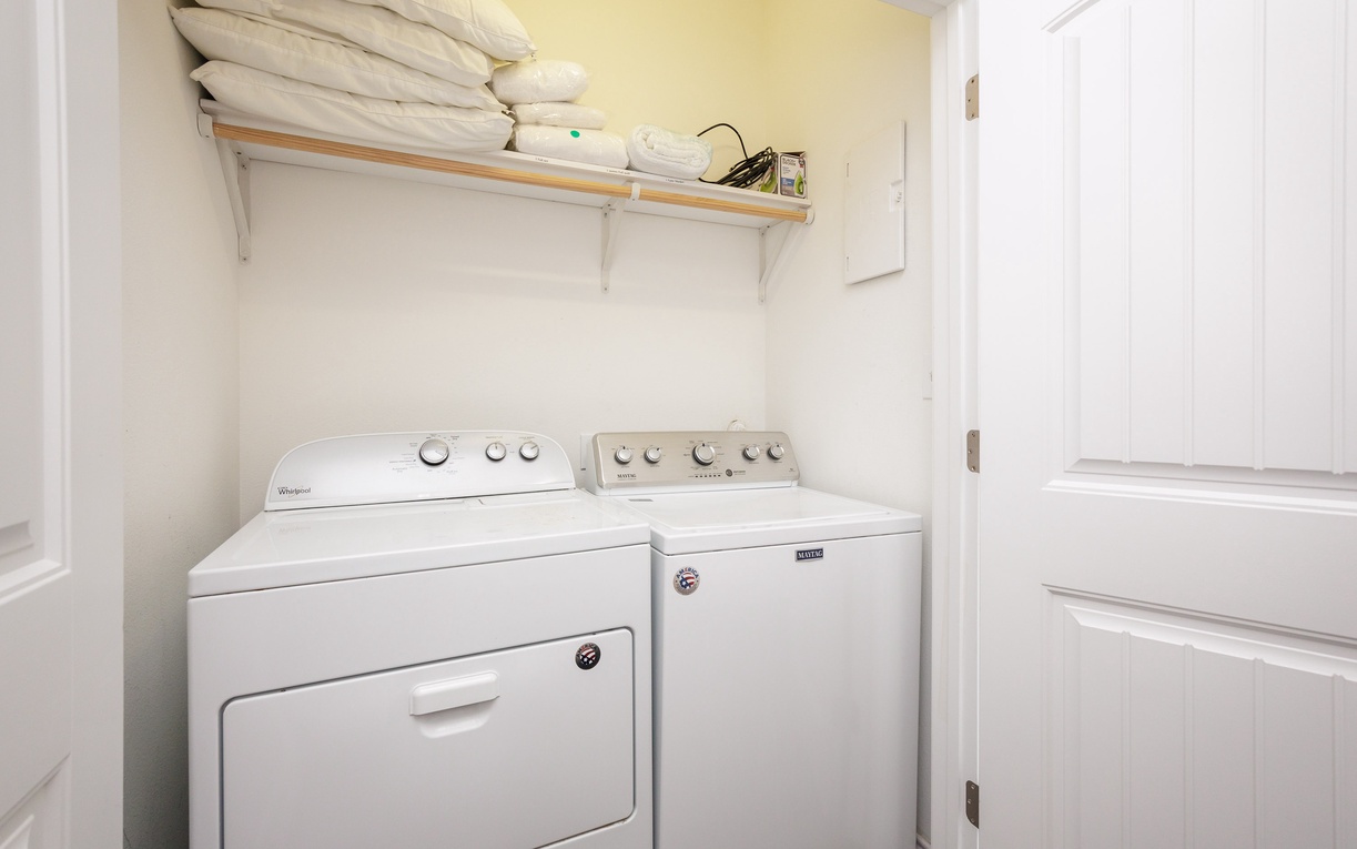 Your private laundry room keeps clothes fresh with full-size washer and dryer, plus convenient shelf storage for linens.