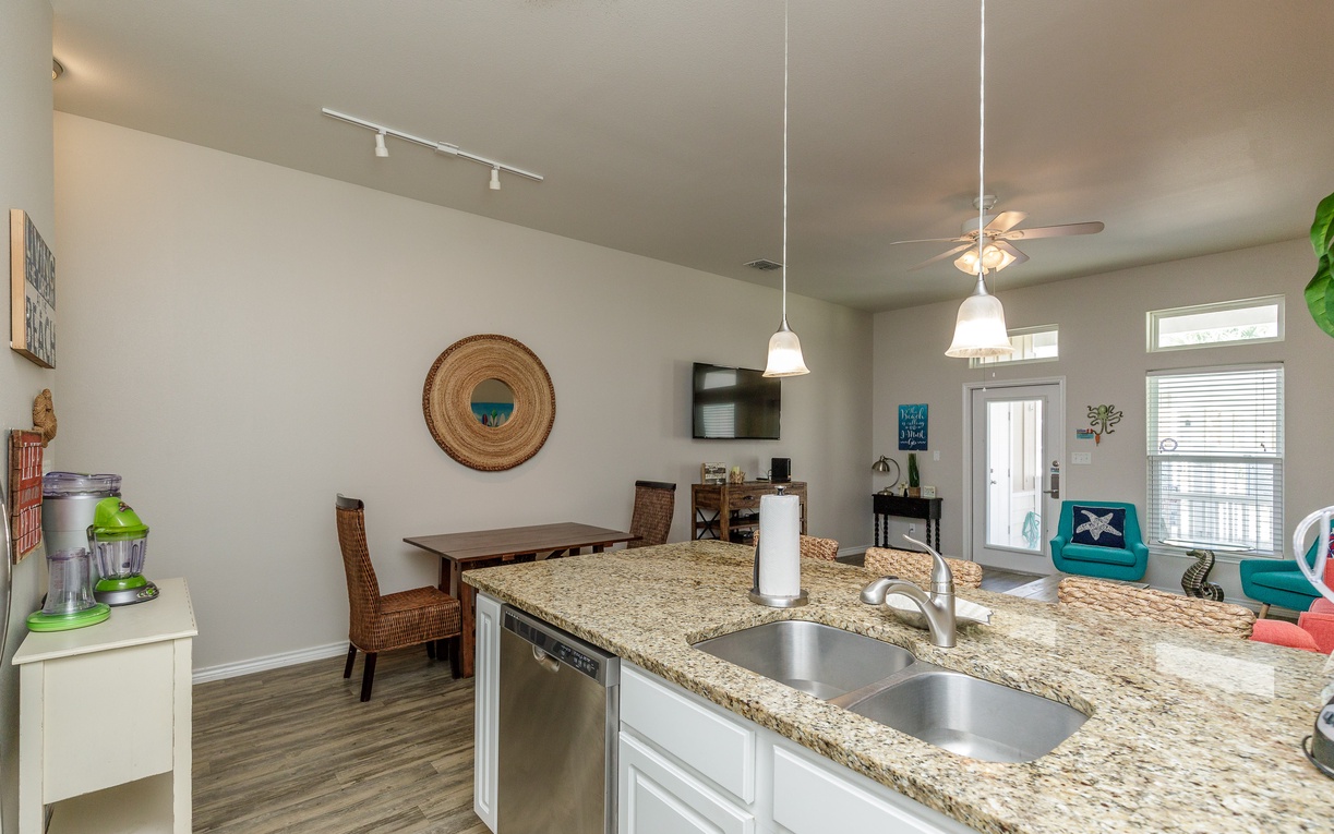 Your open kitchen flows seamlessly into the dining and living area, creating a bright, welcoming space for cooking and gathering together.