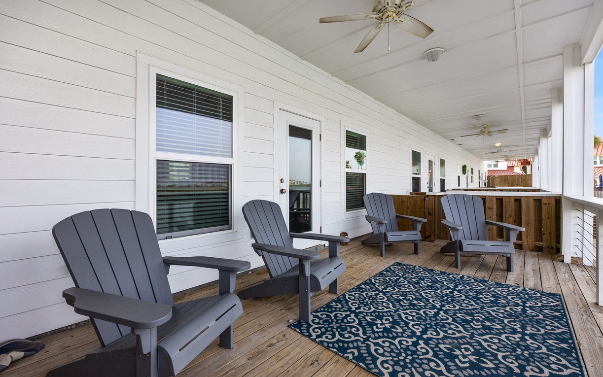 Unwind in your private covered porch with comfortable Adirondack chairs and outdoor kitchen—perfect for morning coffee or evening relaxation.