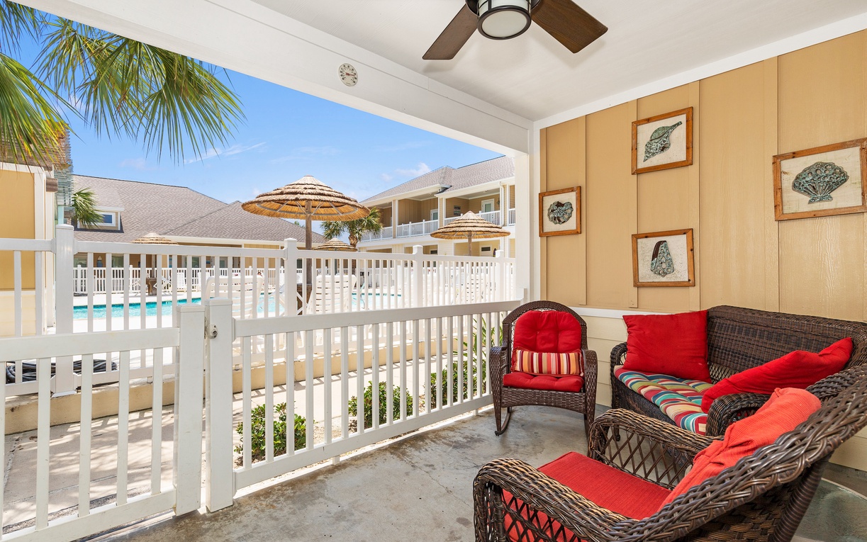 Unwind on your private balcony with vibrant cushioned seating, tropical pool views, and refreshing ocean breezes.