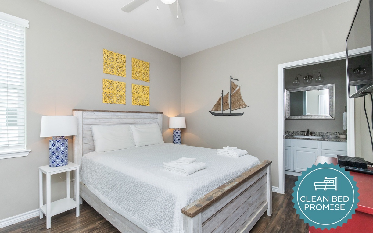 Your cozy bedroom features crisp linens, nautical decor, and an ensuite bathroom for ultimate comfort.