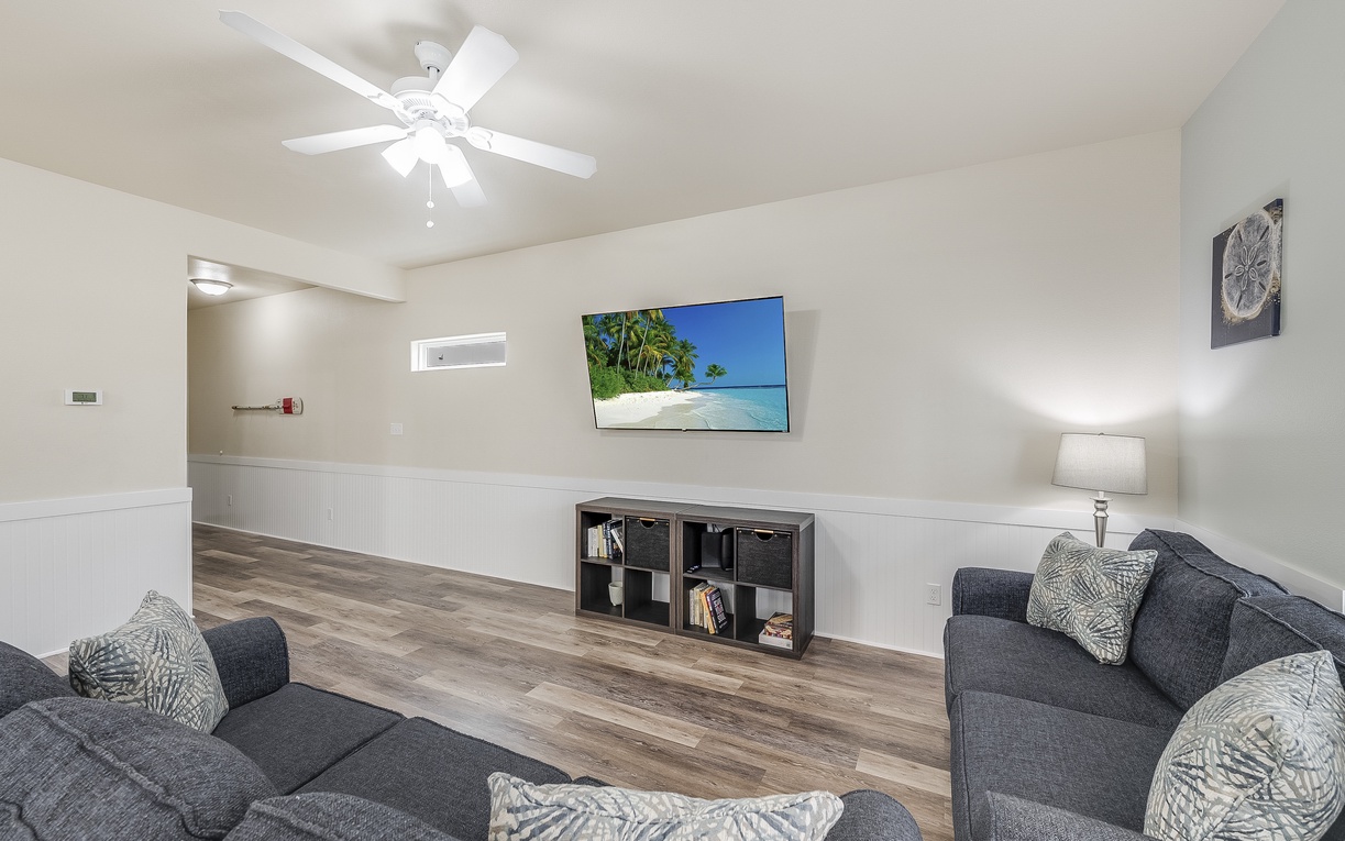 Unwind in your stylish living space with plush seating, tropical views on the large TV, and coastal touches throughout.