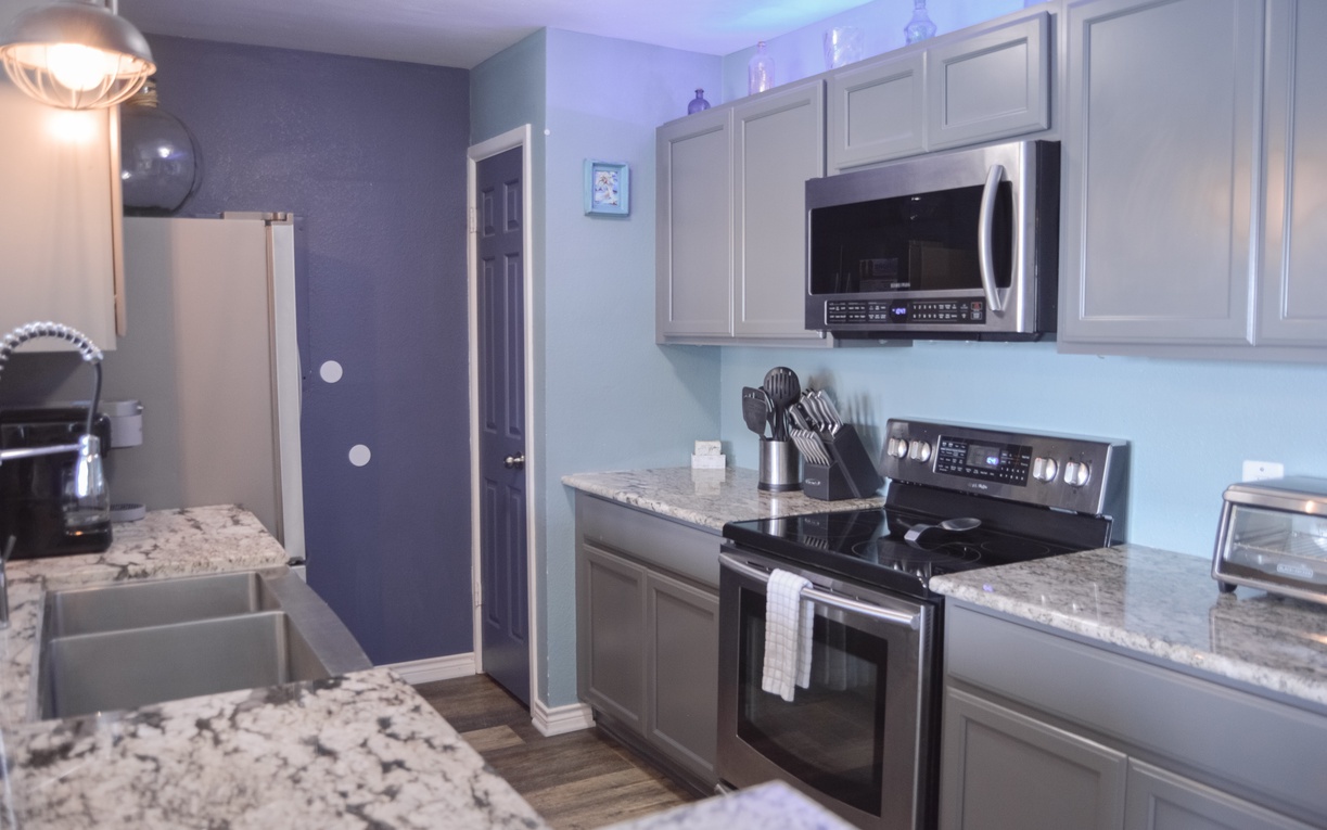 Your modern kitchen awaits with granite counters, stainless appliances, and everything you need to create memorable meals during your stay.
