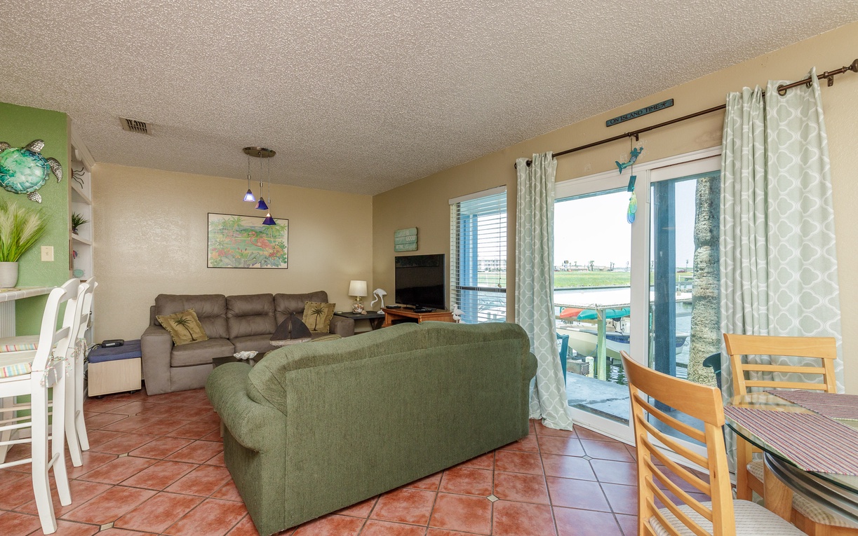 Unwind in your bright living space with comfortable seating and sliding doors that open to reveal your private balcony overlooking the water.