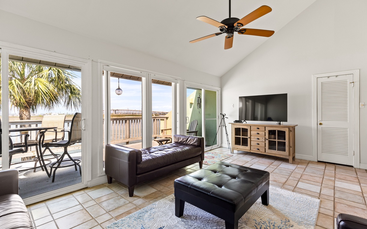 Relax in your bright living space with sweeping ocean views from floor-to-ceiling windows and private balcony access.
