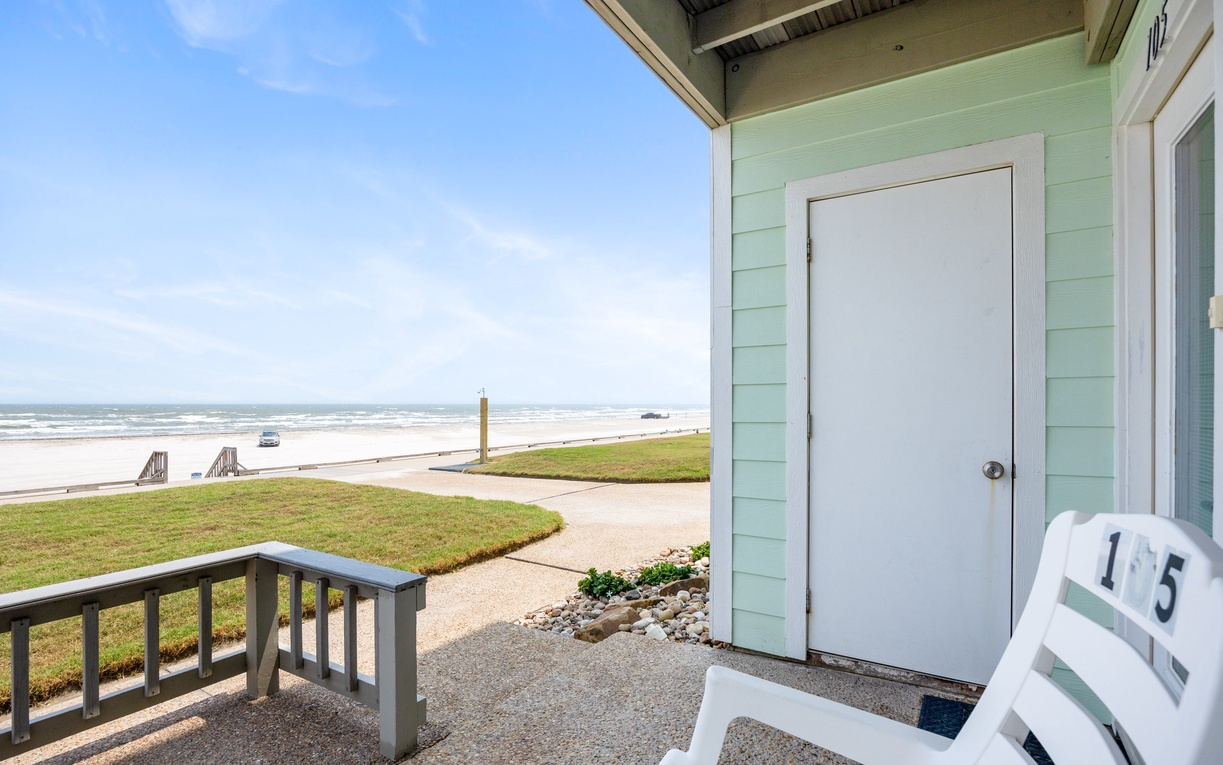 Beachfront property entrance with direct ocean access and sandy beach just steps from your door.