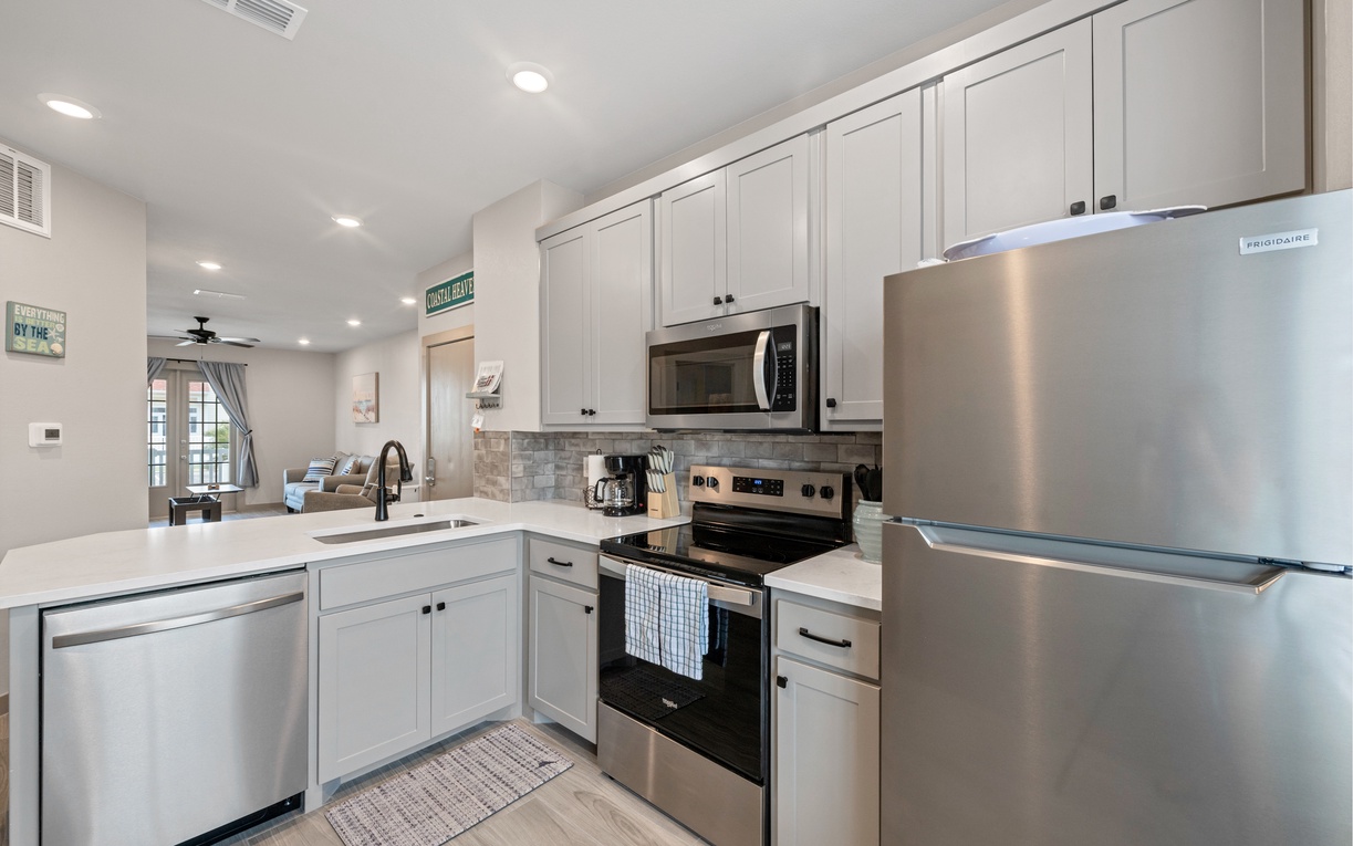 Your fully equipped kitchen awaits with stainless steel appliances, granite counters, and everything needed to create memorable meals during your stay.
