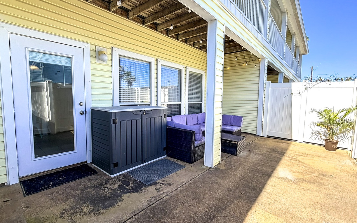 Relax on your private covered patio with comfortable seating, perfect for morning coffee or evening conversations.