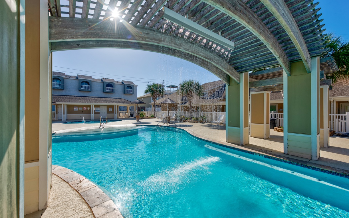 Dive into your private oasis under this stunning covered pergola, where crystal-clear waters await your morning swim.