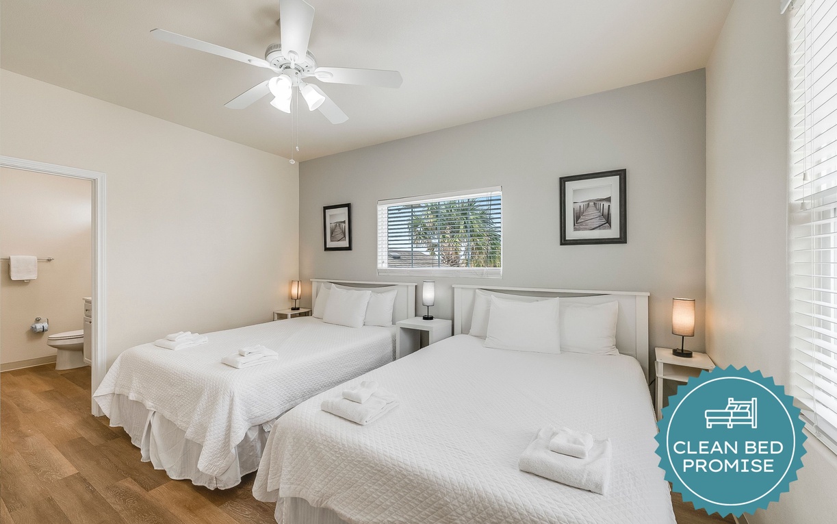 Rest peacefully in your bright bedroom featuring crisp linens, gentle ceiling fan, and natural light streaming through windows.