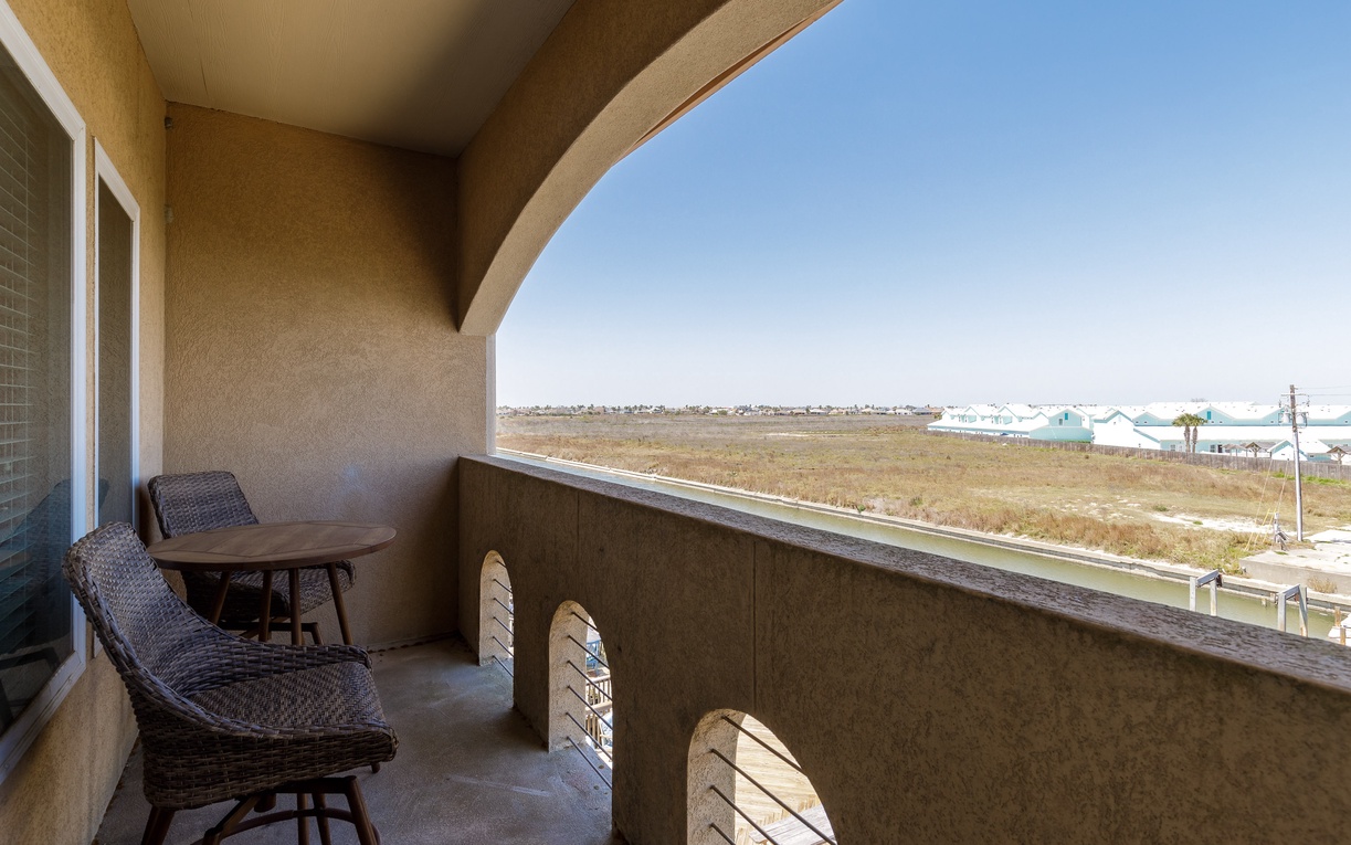 Relax on your private balcony with morning coffee while taking in sweeping views of the coastal landscape stretching to the horizon.
