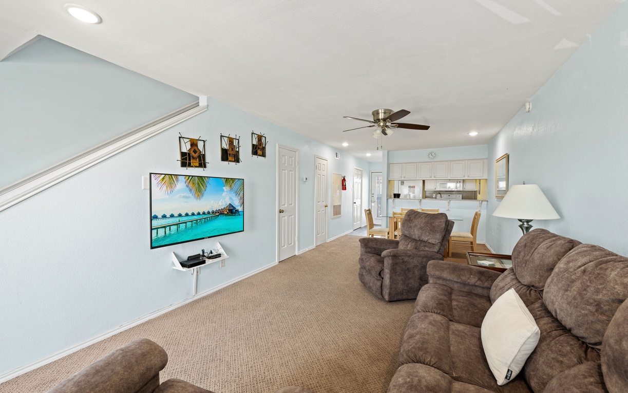 Your spacious living area features vaulted ceilings, plush seating, and an open flow to the kitchen—perfect for relaxing or gathering with family and friends after a day of adventure.