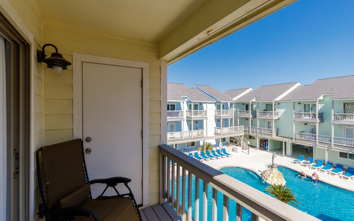 Step onto your primary bedroom balcony and soak in the perfect pool view.