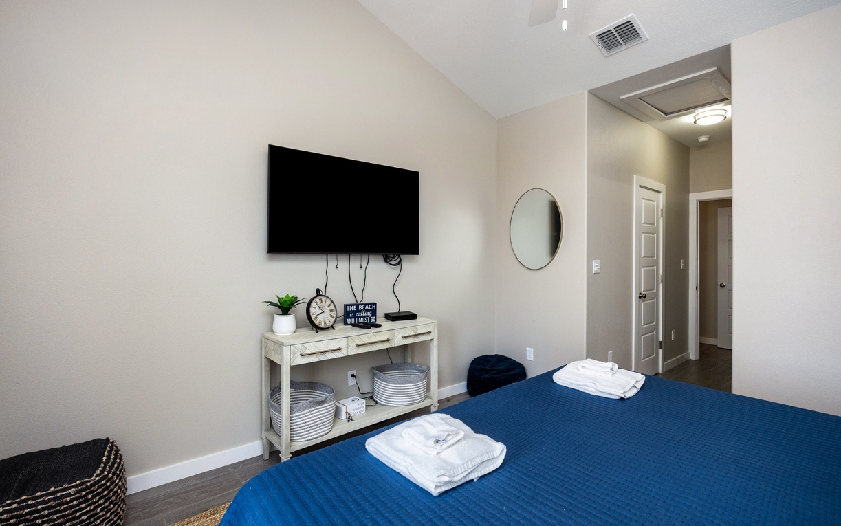 Unwind in your peaceful bedroom with modern touches, crisp linens, and thoughtful amenities for your comfort.
