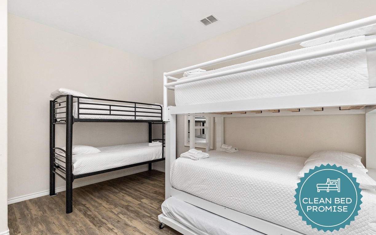 Sleep soundly in your spacious bunk room with crisp white linens and modern amenities for families or groups.