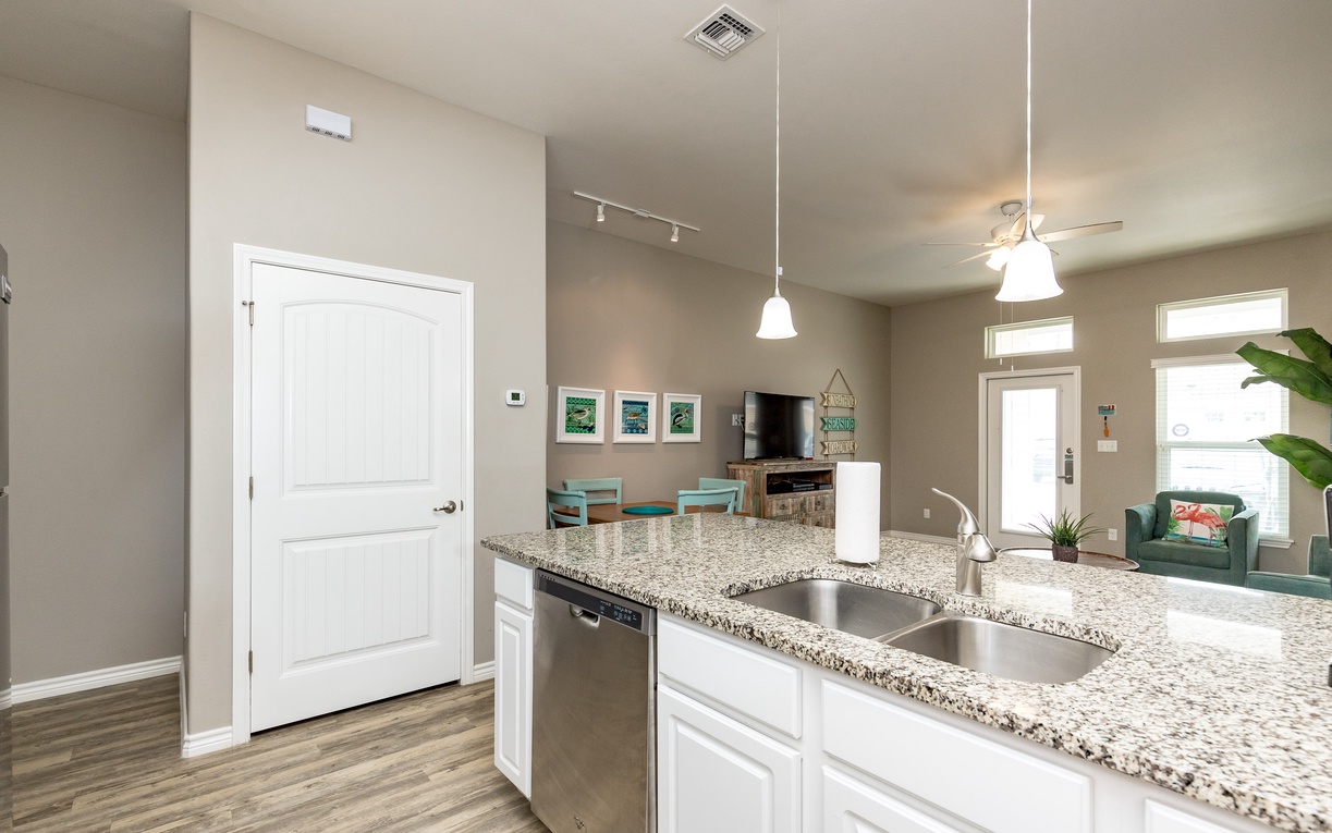 Your open-concept space flows seamlessly from granite kitchen to cozy living area, creating the perfect gathering spot for memorable vacation moments.