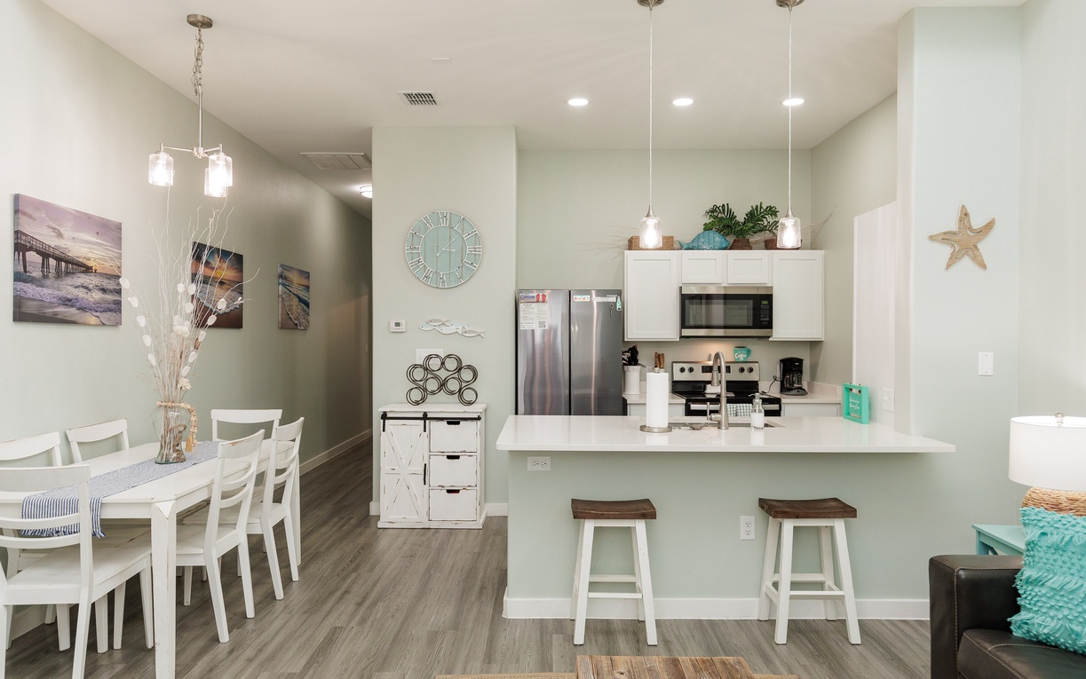 Your bright, open-concept kitchen flows seamlessly into the dining area, perfect for preparing meals and gathering together.