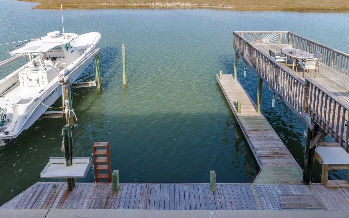 Private dock and boat slip with waterfront access for your maritime adventures.