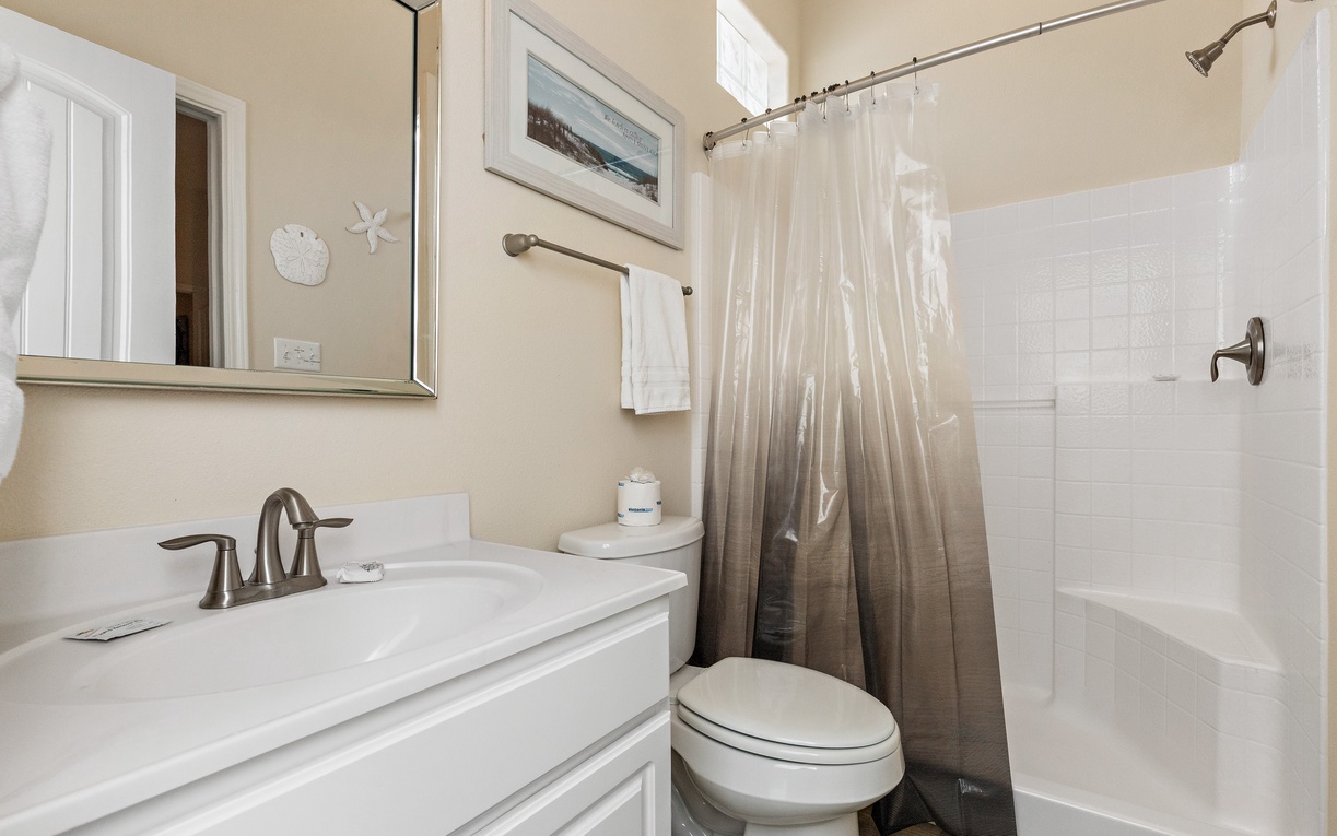 Fresh towels await in your thoughtfully designed bathroom, complete with a relaxing tub-shower combo for unwinding after your adventures.