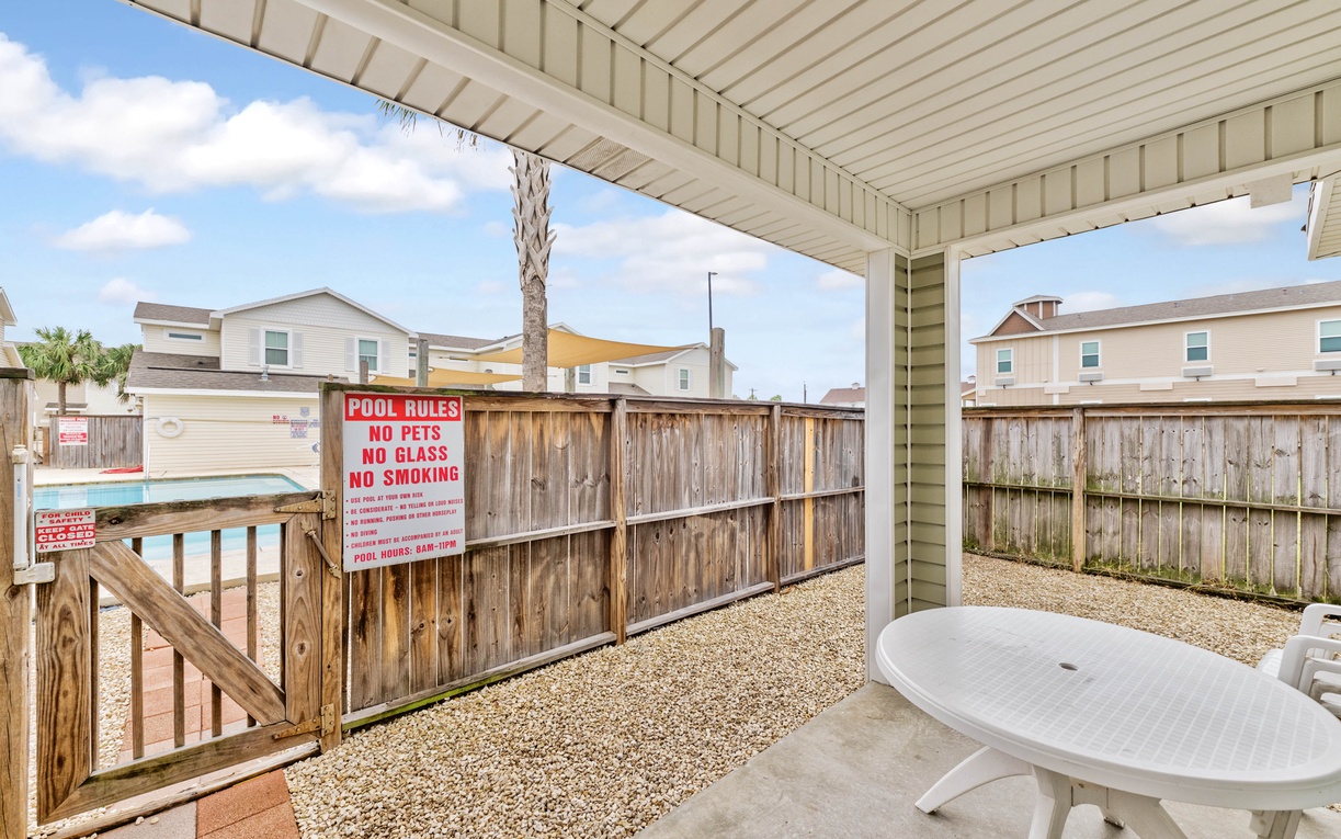 Your private covered patio offers peaceful outdoor dining with a view of the neighborhood.