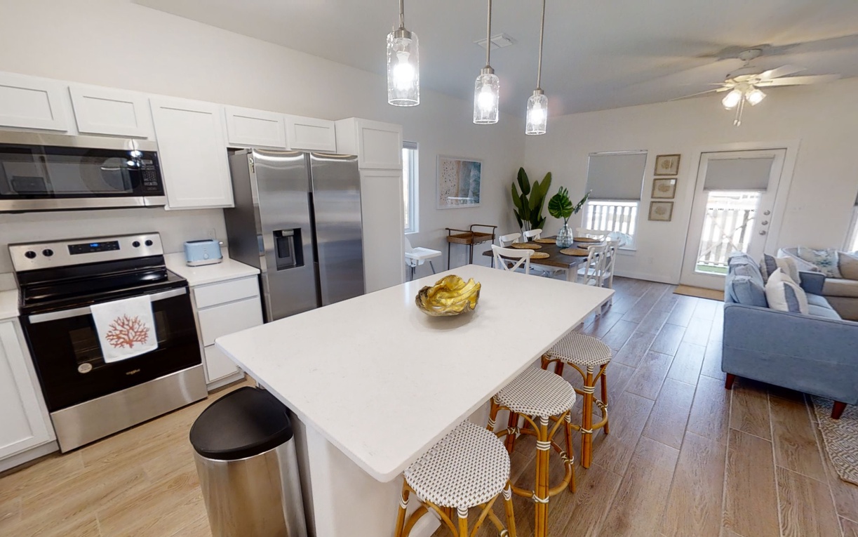 You'll love cooking in this bright open kitchen with modern appliances and spacious island seating for casual meals with family.