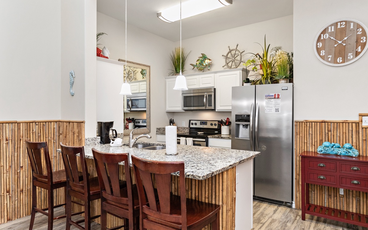 Gather around your fully-equipped kitchen island with granite counters, stainless appliances, and nautical touches for memorable meals.