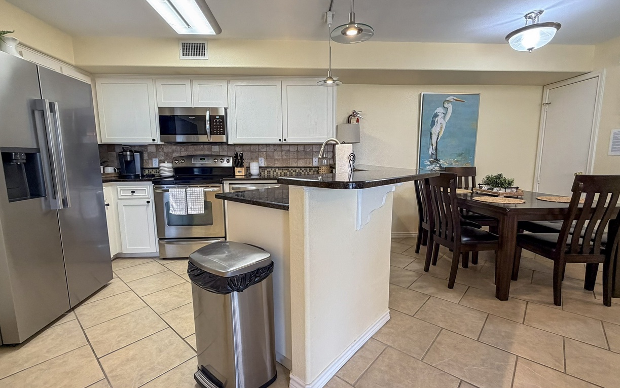 Your fully equipped kitchen features stainless steel appliances and granite countertops, perfect for preparing meals during your stay.