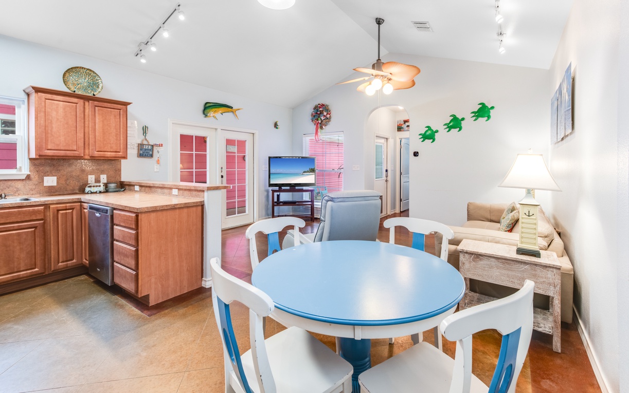 Your beach-themed retreat features a fully equipped kitchen and cozy dining space where you'll love sharing meals with colorful coastal charm.