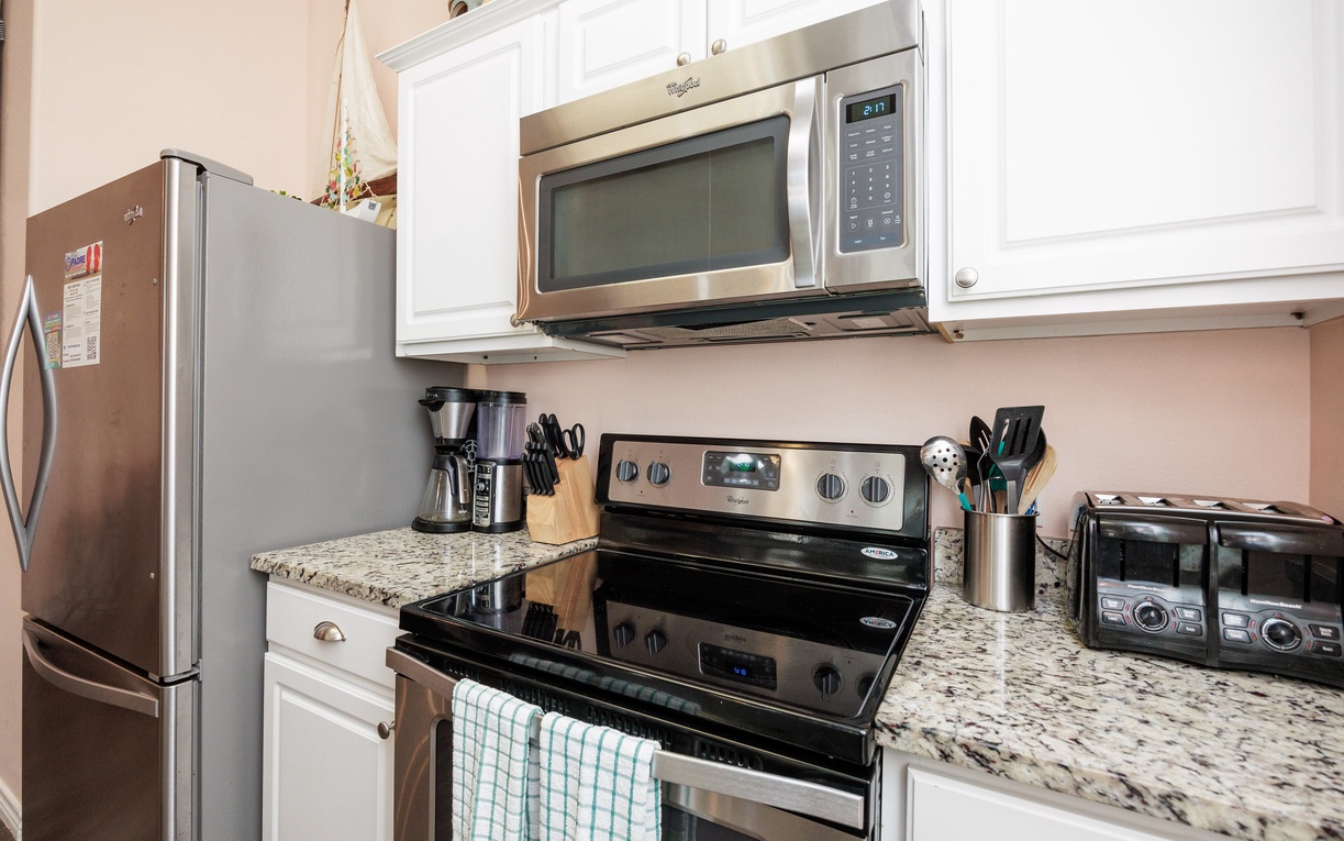 Your fully equipped kitchen features stainless steel appliances and granite countertops, perfect for preparing meals during your stay.