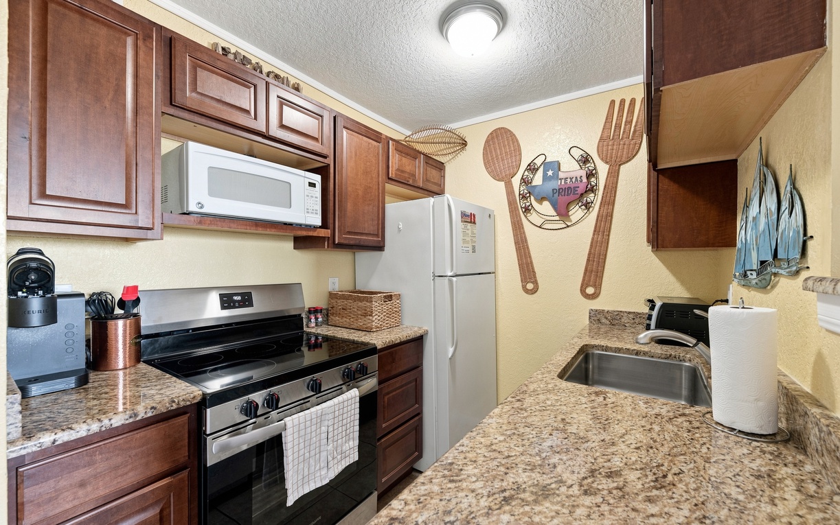 Step into your fully equipped kitchen with granite countertops, stainless appliances, and all the essentials to cook up your favorite meals during your stay.