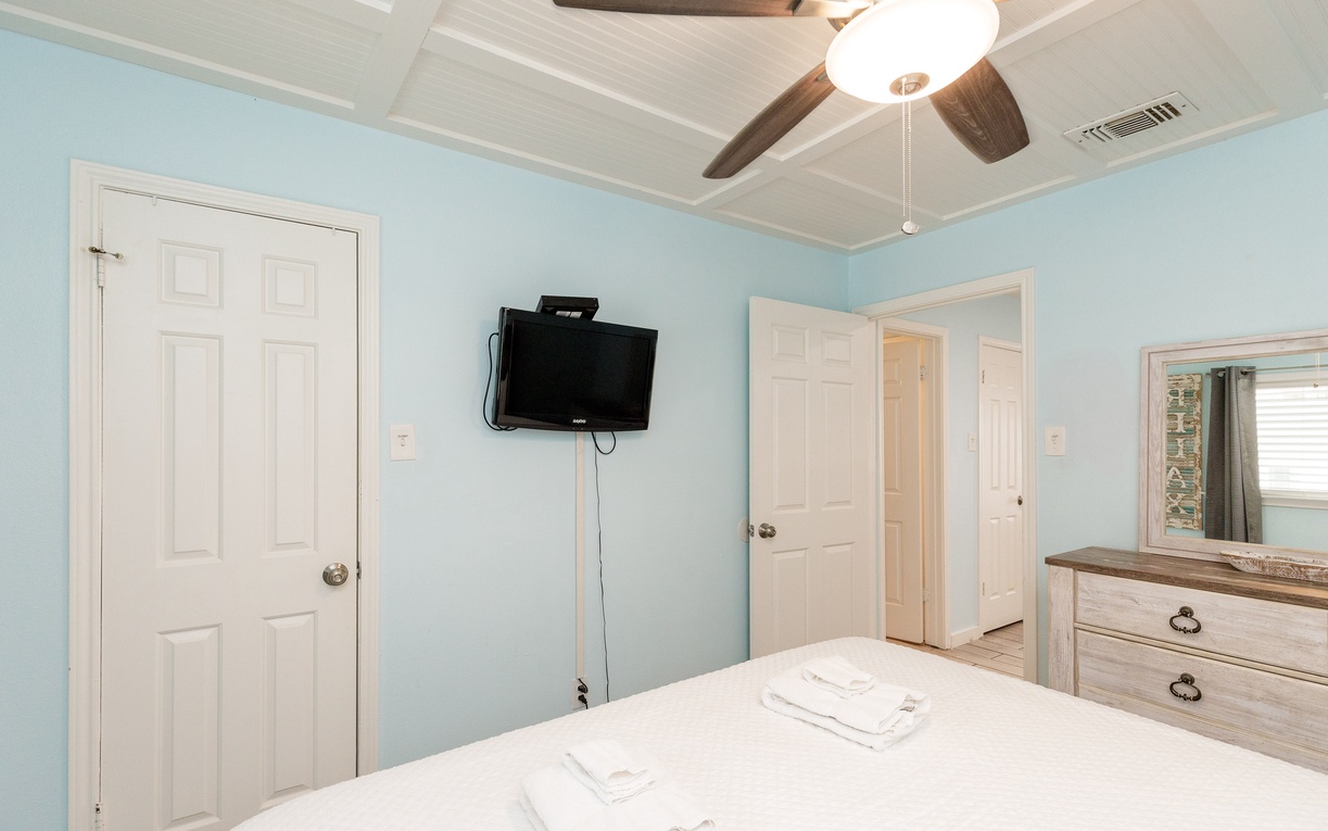 Drift off peacefully in your bright, airy bedroom with cooling ceiling fan and flat-screen TV for unwinding.